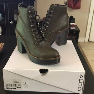 Green Aldo boots.